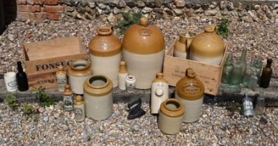 A collection of vintage stoneware flagons, jars glass bottles