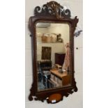 A bevelled wall mirror