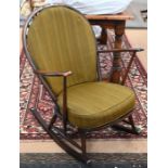 An Ercol dark elm 'fleur-de-lys' and spindle back rocking chair