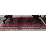An old Persian Afshar rug with triple lozenge design