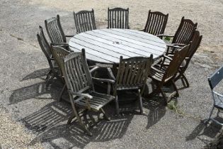 Large teak garden dining table and eleven chairs