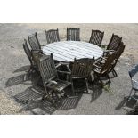 Large teak garden dining table and eleven chairs