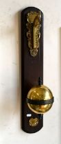A Thwaites & Reed (no 347) brass falling globe gravity clock