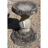 A reconstituted weathered stone pedestal birdbath, 62 cm high