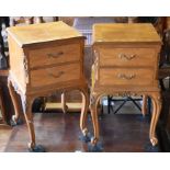 A pair of Indian style two drawer walnut bedside chests