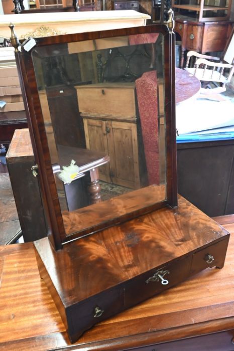 A 19th century mahogany platform toilet mirror with three drawers