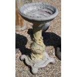 A reconstituted stone pedestal birdbath cast with vines of trailing blackberries, 74 cm high