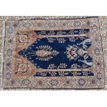 An antique Persian hand-made Kashan rug