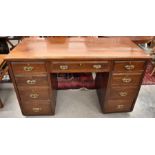 An Edwardian mahogany kneehole desk