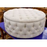 A large circular button upholstered centre stool
