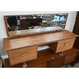 A mid century teak and aframosia wide dressing table