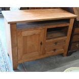 An oak sideboard with panelled cupboard