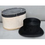 A vintage top hat in card box