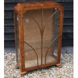 An Art Deco walnut display cabinet