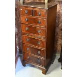 A reproduction seven drawer chest