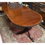 A reproduction mahogany D-end dining table
