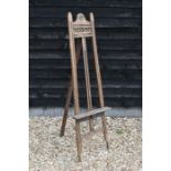 A vintage fret cut oak folding easel