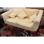 A Brights of Nettlebed mahogany two seater scroll arm sofa
