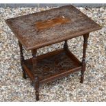 A rectangular oak two-tier side table