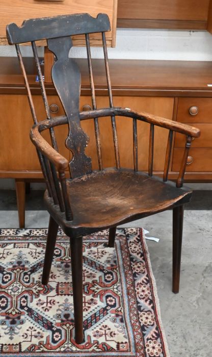 A 19th century provincial elm and ash comb back chair