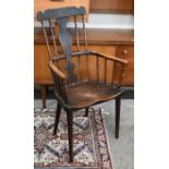 A 19th century provincial elm and ash comb back chair