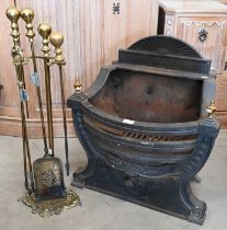 A Regency-style cast iron fire basket and tools