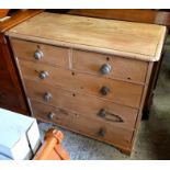 A stripped pine chest of two short over three long drawers