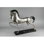 A large Art Deco silver and black patinated bronze horse