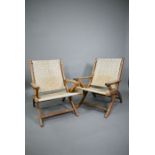 A pair of Danish style hardwood and cane chairs (2)