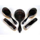 A silver and tortoiseshell piqué five-piece brush set