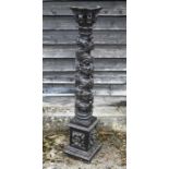 An antique carved solomonic style vine leaf design column