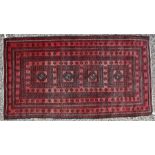 A fine old Afghan Belouch rug, 190 cm x 105 cm