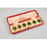 A set of six green enamel studs with clips