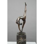 Milo - a brown-patinated bronze figure of a female contortionist