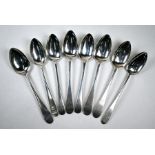 A mixed set of seven George III Scottish silver dessert spoons