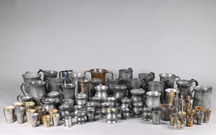 Over fifty Victorian and later pewter and other measures