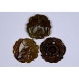 Three Chinese carved jade or other hardstone amulets