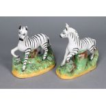 A pair of 19th century Staffordshire pottery zebras