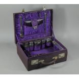 A purple leather small suitcase