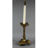 A Victorian Gothic Revival gilt bronze torchere