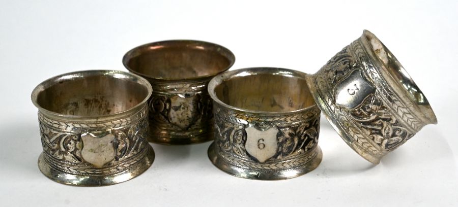 Four Indian white metal napkin rings