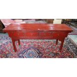 An antique Chinese red lacquer four drawer side table