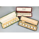Three cased sets of mother-of-pearl round studs and clips