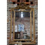 An antique French carved and moulded giltwood mirror