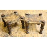 Two matched antique African low stools