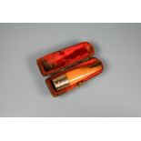 An amber and 9ct gold cheroot holder in fitted case