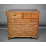 An 18th century cross-banded oak chest of drawers
