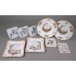 Four faience plates and five Delft tiles