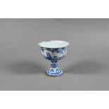 A Chinese late Ming blue and white 'Go Players' stem cup, probably Chongzhen (1628-44)