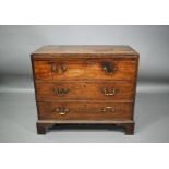 A Georgian mahogany chest of three long drawers